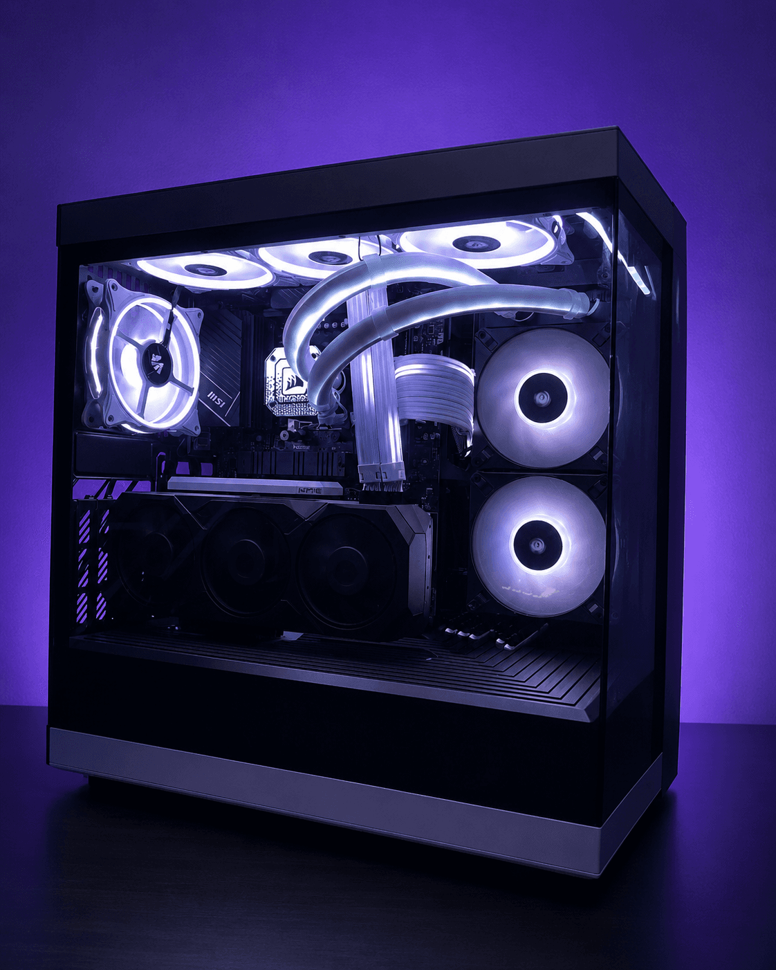 Black Hyte Y40 gaming PC with white and purple lighting, liquid cooler tubes, cable lighting, and XFX Radeon graphics card