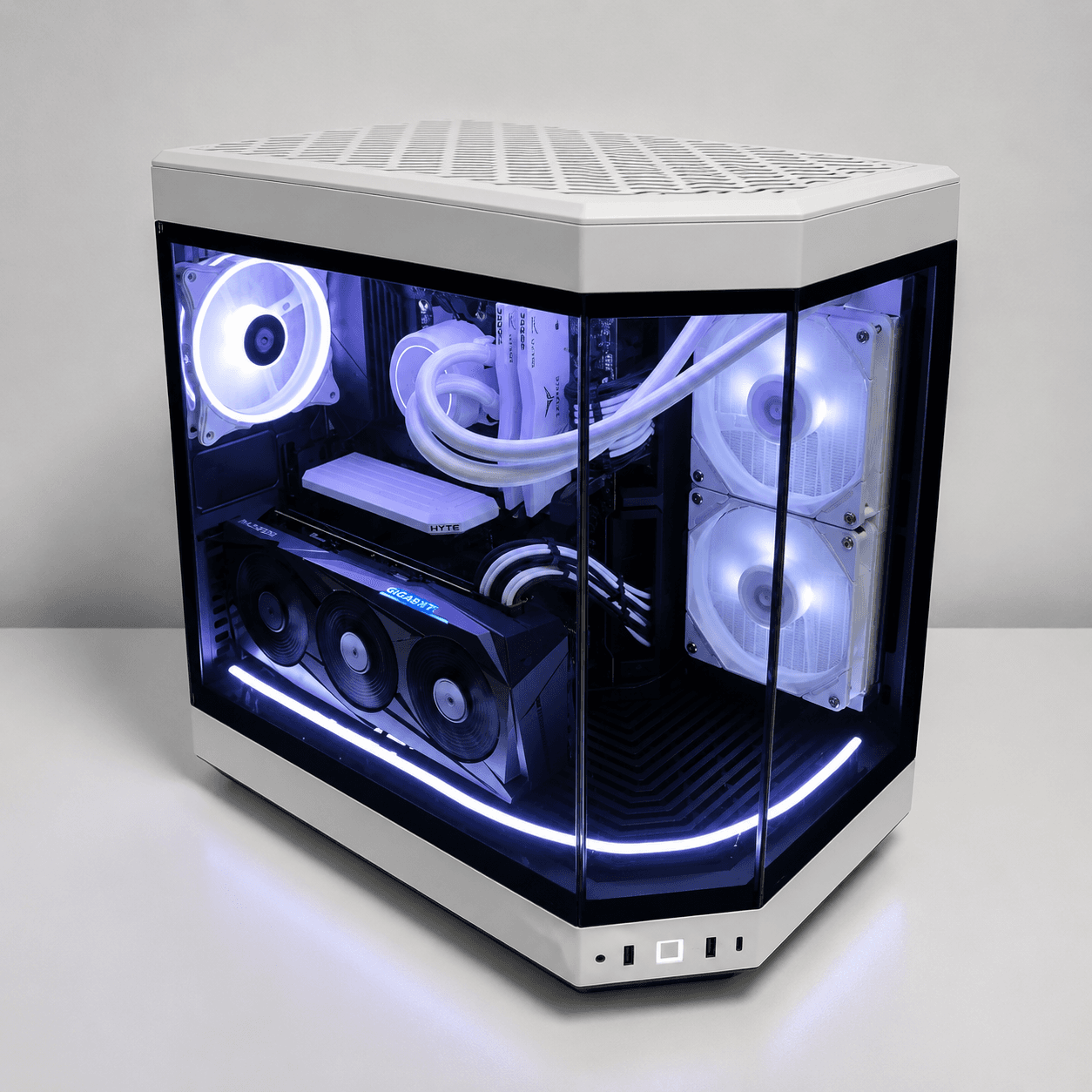 White Hyte Y60 gaming PC with wraparound glass, white RGB fans, white liquid cooler, black graphics card, and LED strip lighting